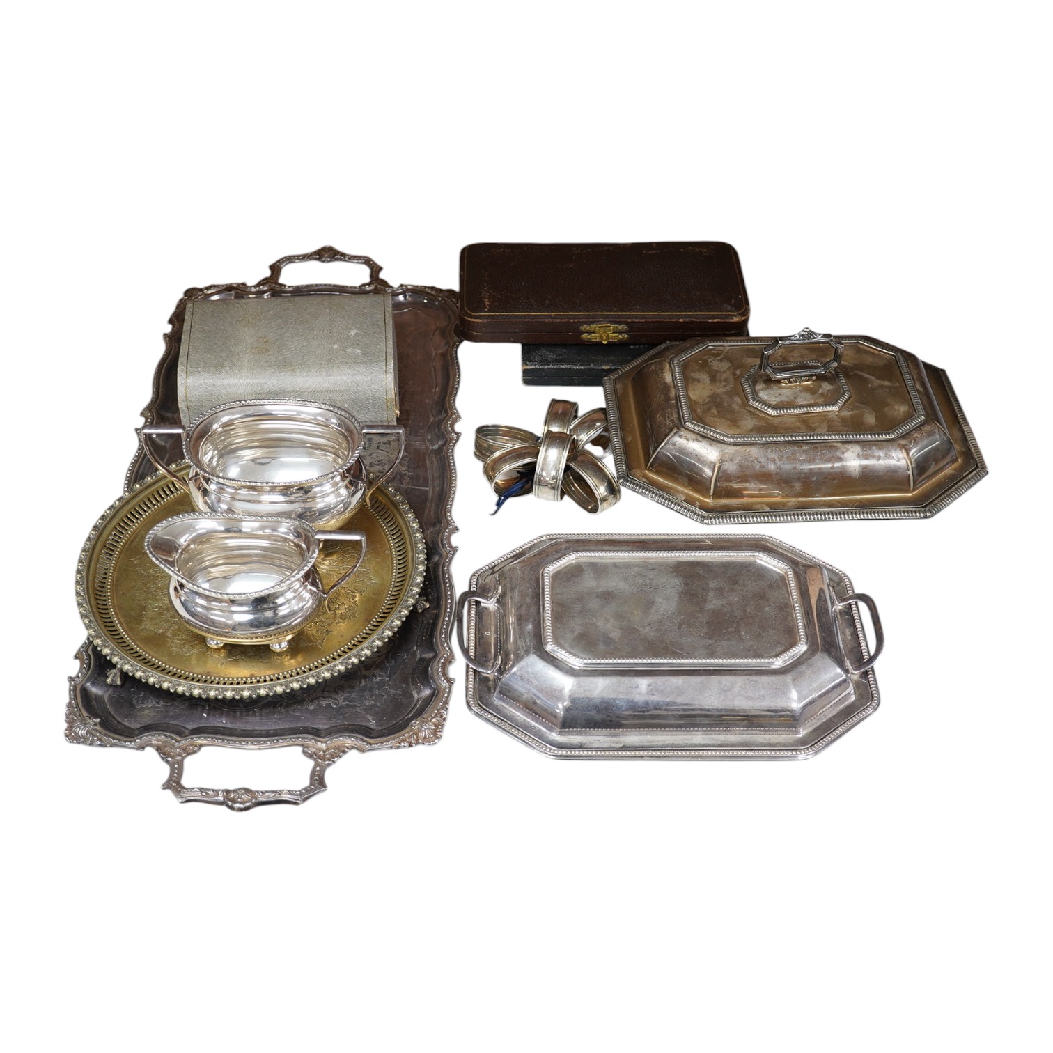 A quantity of plated wares including two entree dishes and covers, napkin rings, cream jug, trays, etc. Condition - fair